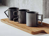 Aandersson Kitchen set of mugs - 3 Grey sculptural concrete mugs with different geometrically shaped handles - square, curved and triangular