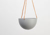 The STONE BLOCK COLOR DOME HANGING PLANTER IS SKILLFULLY HAND MADE FROM RESIN AND FINISHED WITH TAN LEATHER The planter has a hole in the bottom for drainage and a plug for convenience. Designed in Australia. Worldwide shipping. Free UK shipping.