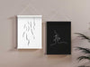 moxon magnetic print frames in black and white with abstract line drawing prints in them