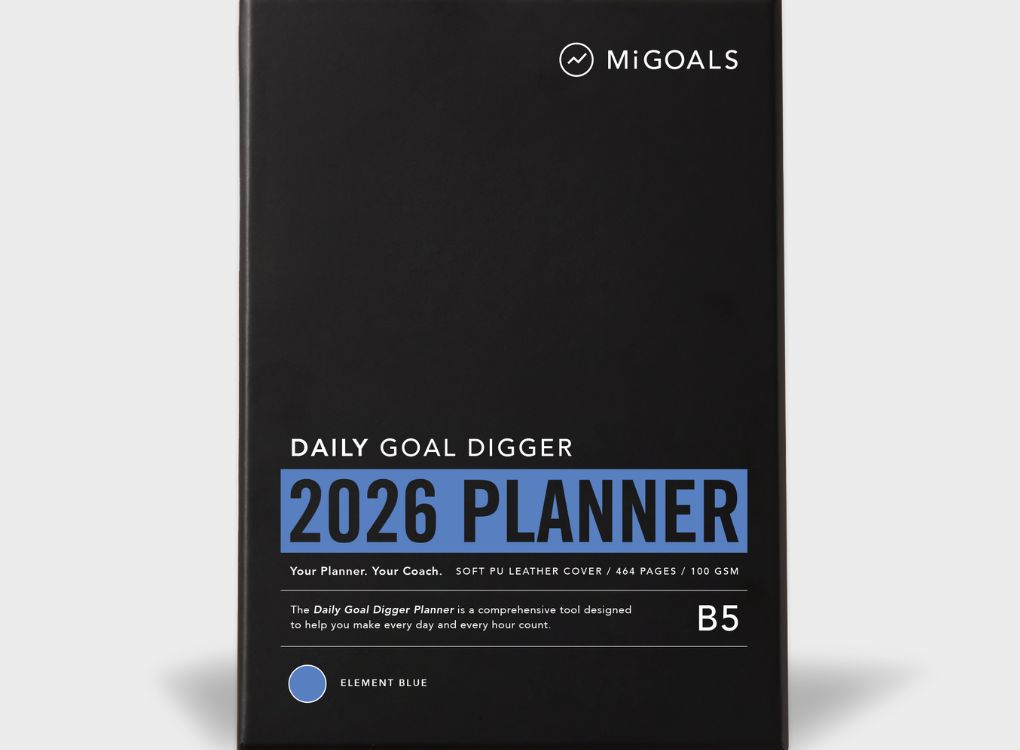 2026 Daily Goal Digger Diary in Progress over perfection. White cover with abstract shapes against a soft natural background.