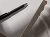 2026 Daily Goal Digger Diary in Vanilla Bean. White cover with a black pen on cover against a soft natural background.