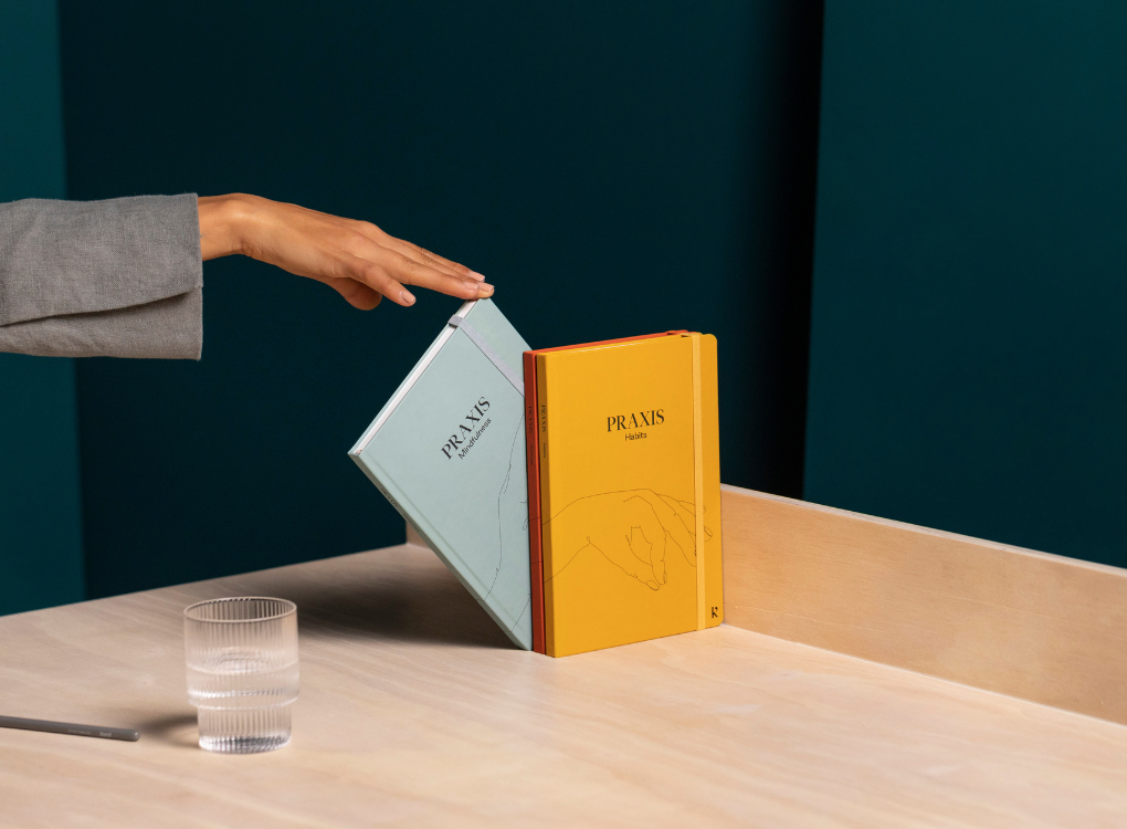 Karst Praxis set of 3 journals stacked on a desk. Environmentally friendly stone paper