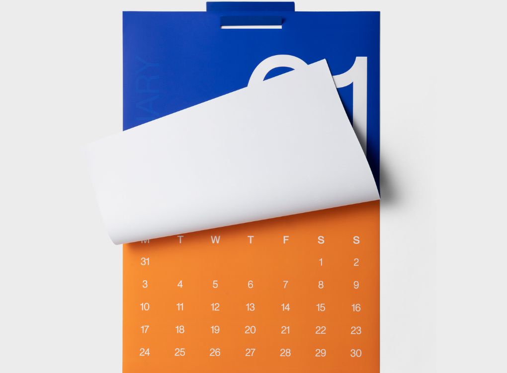 Karst 2026 A2 Monthly Calendar with a page flip revealing February in orange, underneath January’s large blue date design.