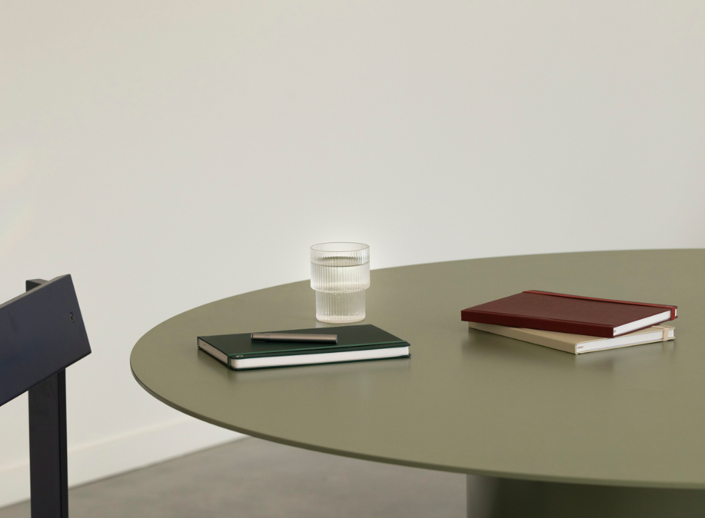 Karst hardcover A5 notebooks stacked on a table.