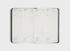 MiGoals 2026 Classic Diary monthly budget planner spread with sections for income, expenses, saving goals, and monthly cash flow from January through April.