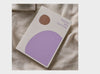 2026 Daily Goal Digger Diary in Progress over perfection. White cover with abstract shapes against a soft natural background.
