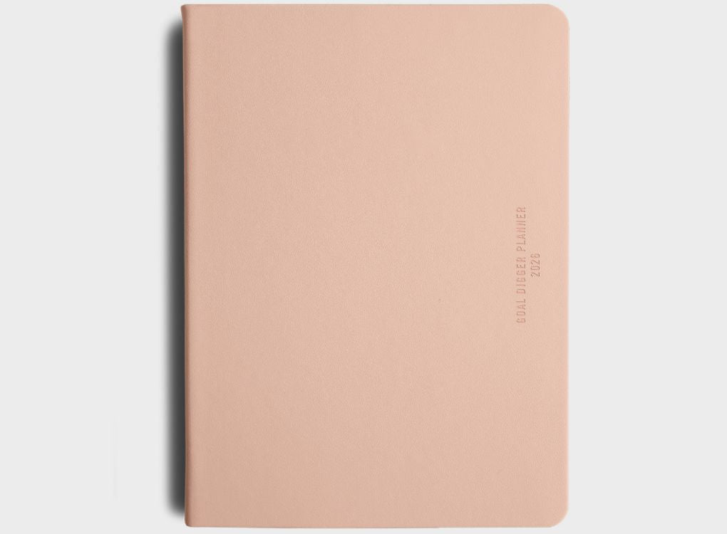 MiGoals 2026 Classic Diary in just peachy with “Goal Digger Planner 2026” embossed vertically on the right-hand side.