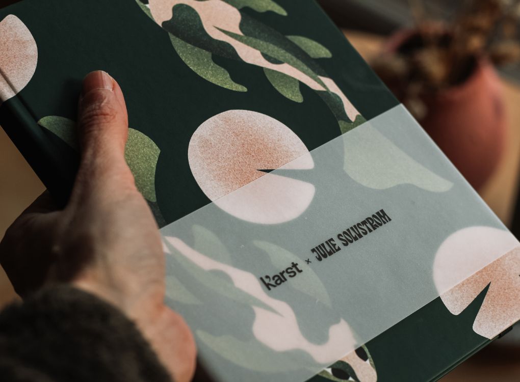 Close-up of Karst x Julie Solvstrom limited edition hardcover notebook cover showing koi fish artwork and soft-touch finish.