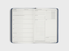 Weekly spread of the MiGoals 2026 Classic Diary with sections for daily planning, gratitude, habits, goals, tasks, notes, wins, and weekly reflection.