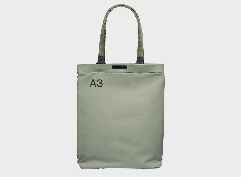 A3 Eucalypt Tote Bag being displayed on a grey background. 
