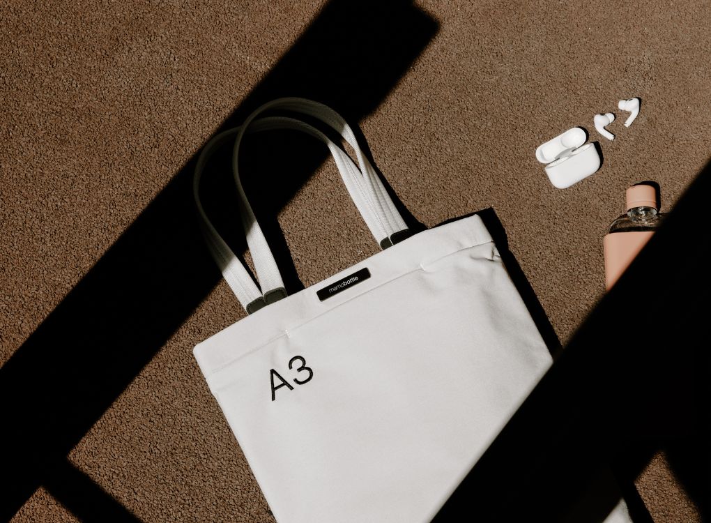 A3 Paperbark Tote Bag being displayed on a carpet.