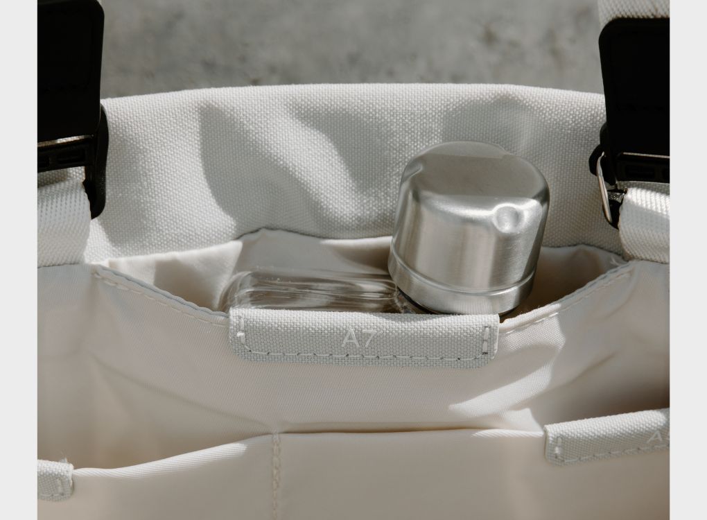 Memobottle in designated Memobottle pouch being depicted in A3 Paperbark Tote Bag.