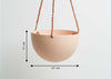 The SALT BLOCK COLOR DOME HANGING PLANTER IS SKILLFULLY HAND MADE FROM RESIN AND FINISHED WITH TAN LEATHER The planter has a hole in the bottom for drainage and a plug for convenience. Designed in Australia. Worldwide shipping. Free UK shipping.