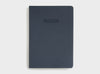 Front cover of migoals progress journal in navy blue, designed to motivate you to achieve your dreams and goals