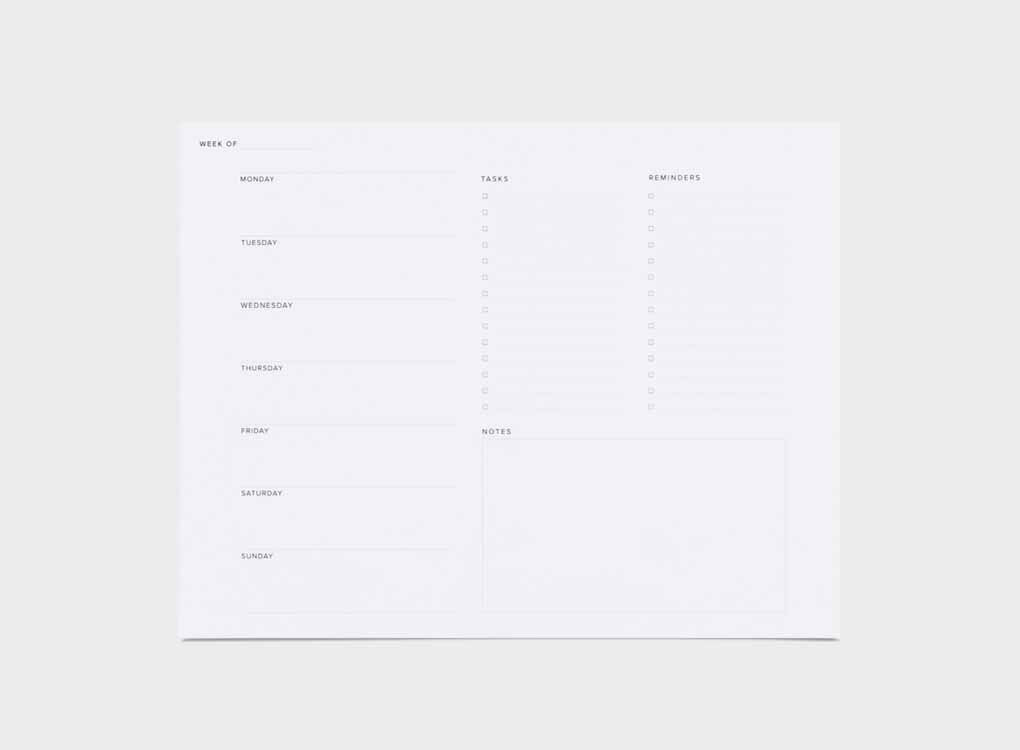 Appointed's weekly task pad, with a pencil and a cactus. The sheet has lists and days of the week on it.