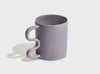 aandersson annika shapes mug in a light grey with a contemporary curved handle and a brushed matte finish