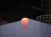 areaware goober candle in pink, burning