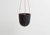 CAPRA DESIGNS HANGING PLANTER - MIDNIGHT IS SKILLFULLY HAND MADE FROM RESIN AND FINISHED WITH TAN LEATHER. Each planter has a hole in the bottom for drainage and a plug for convenience. Worldwide shipping. Free UK shipping.