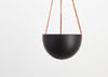 The MIDNIGHT BLOCK COLOR DOME HANGING PLANTER IS SKILLFULLY HAND MADE FROM RESIN AND FINISHED WITH TAN LEATHER The planter has a hole in the bottom for drainage and a plug for convenience. Designed in Australia. Worldwide shipping. Free UK shipping.