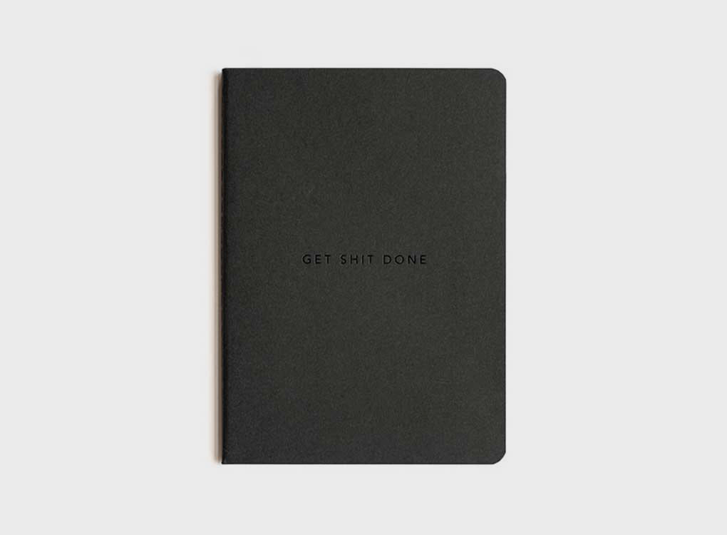 migoals get shit done to do list and notebook in black, with a subtle motivational quote on the front, designed to increase productivity and inspire ideas.