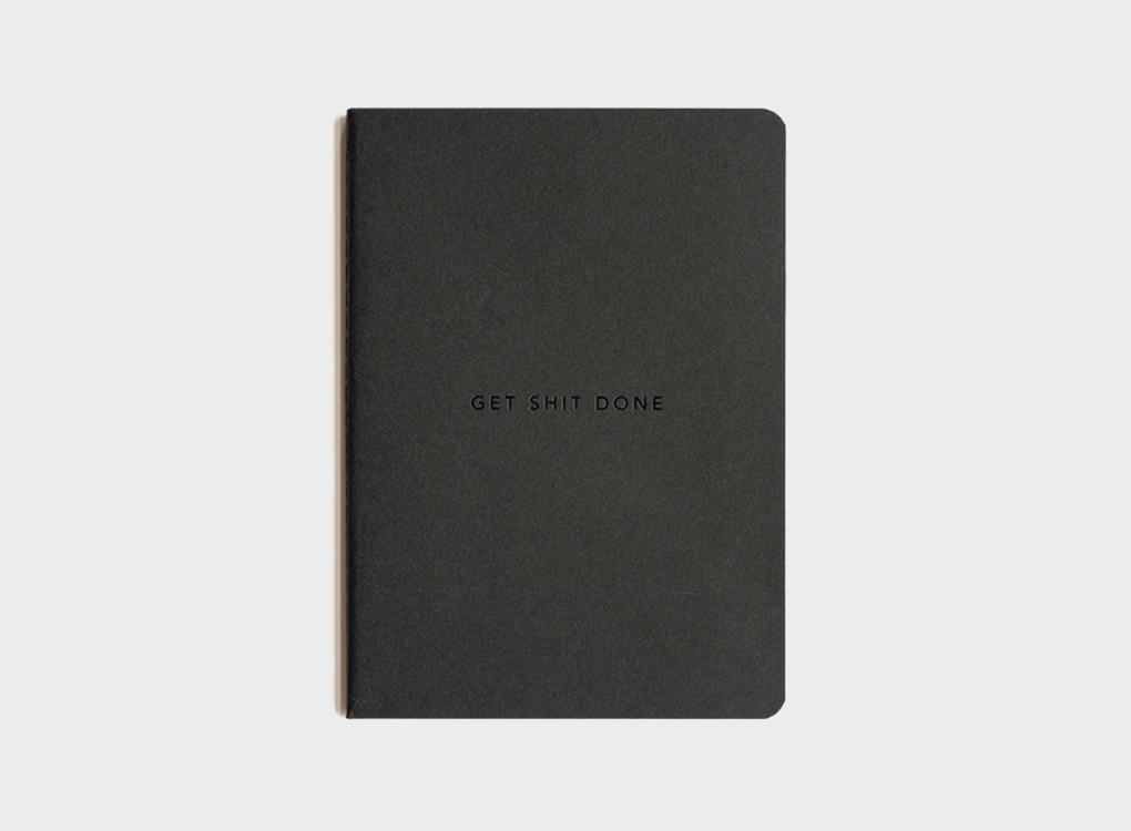 Migoals GSD get shit done Minimal notebook in all black, with a motivational quote to inspire you and a versatile dot grid format for all work types.