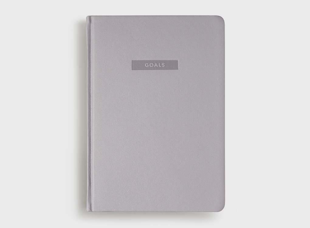 MiGoals goal journal front cover in grey, designed to get you to achieve your dreams.
