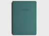 Front cover of migoals progress journal in teal green, designed to motivate you to achieve your dreams and goals